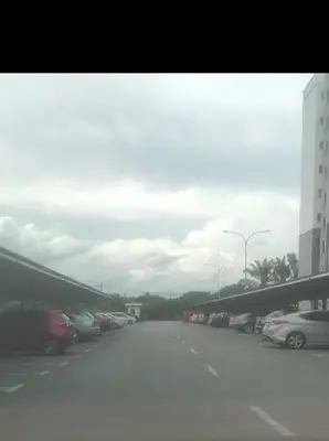 a view of a parking lot with cars parked at Homestay Millazzz Apparment Ipoh in Kampong Duson Gilap