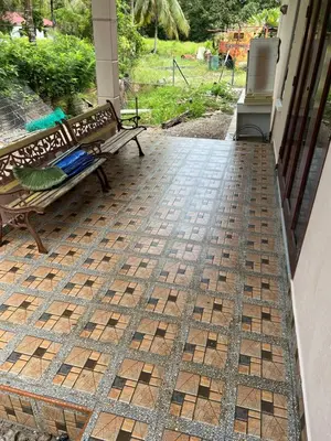 a porch with a bench on a patio at Joe’s Homestay Raub Phg in Raub