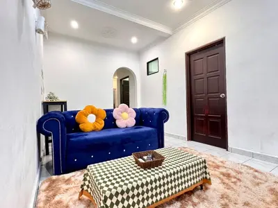 a blue couch with stuffed animals on it in a living room at Cozy14#4pax#Wifi#NearAeonAlma#5kmtoIconCity in Bukit Mertajam