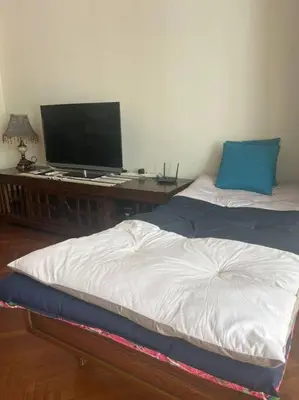 a bedroom with a bed and a desk with a television at Perfect Marina Stay @ Strait Quay 6 Pax Max in Bagan Jermal