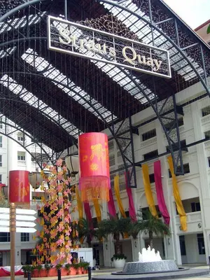 a building with a christmas tree in front of it at Perfect Marina Stay @ Strait Quay 6 Pax Max in Bagan Jermal