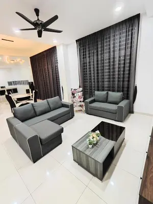a living room with two couches and a table at Ipoh Lake View Cozy Home Big House in Lahat