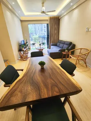 a living room with a wooden table and a couch at The Cove Ipoh Garden East, Taman Ipoh Permai, Garden East, 31400 IPOH in Ipoh
