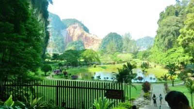 a view of a park with a lake and mountains at The Cove Ipoh Garden East, Taman Ipoh Permai, Garden East, 31400 IPOH in Ipoh