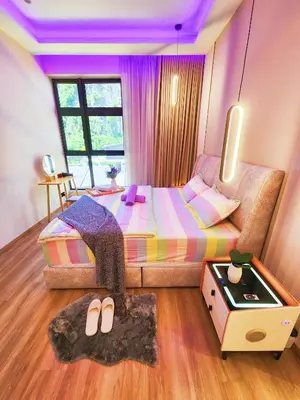 a bedroom with a bed with a purple ceiling at The Cove Ipoh Garden East, Taman Ipoh Permai, Garden East, 31400 IPOH in Ipoh
