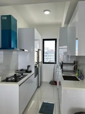 a white kitchen with a stove and a sink at Beacon Executive Suites #Georgetown #RoofTopPool #10 in George Town
