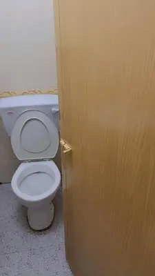 a door leading to a bathroom with a toilet at G99 Hotel in George Town