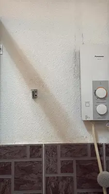 a damage to a ceiling with a thermostrophe at G99 Hotel in George Town