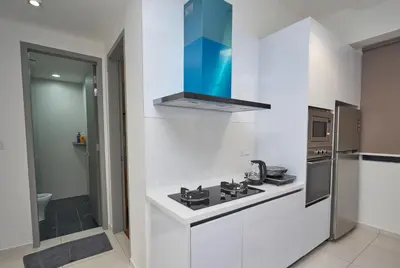 a white kitchen with a stove and a sink at Beacon Executive Suites #CozyFamilyStay #RoofTopPool #13 in George Town