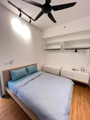 a bedroom with a bed and a ceiling fan at Beacon Executive Suites #CozyFamilyStay #RoofTopPool #16 #10paxs in George Town