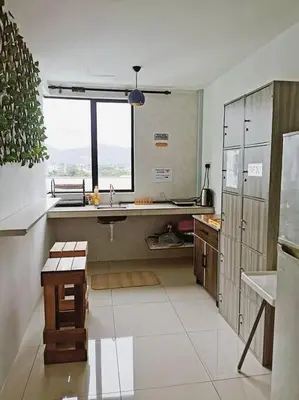 a large kitchen with a sink and a window at Ipoh Manhattan waterpark safari-12pax(projector) in Ipoh