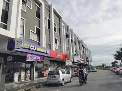 a street with cars and a car parked in front of buildings at Ipoh Manhattan waterpark safari-12pax(projector) in Ipoh