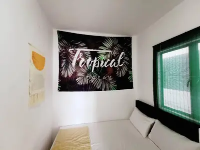 a living room with a sign on the wall at Ipoh Manhattan waterpark safari-12pax(projector) in Ipoh