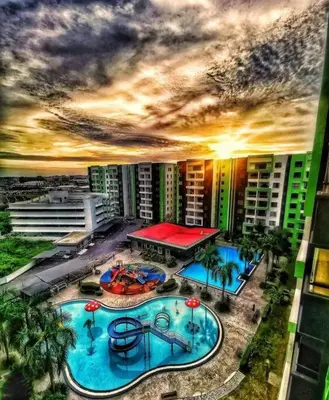 an aerial view of a large swimming pool in a city at Ipoh Manhattan waterpark safari-12pax(projector) in Ipoh