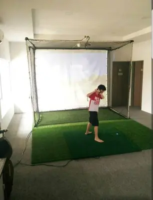 a young man standing in a batting cage at Ipoh Manhattan waterpark safari-12pax(projector) in Ipoh