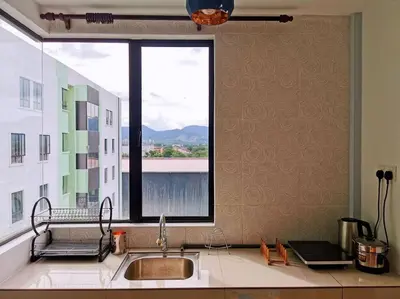 a kitchen with a sink and a large window at Ipoh Manhattan waterpark safari-12pax(projector) in Ipoh