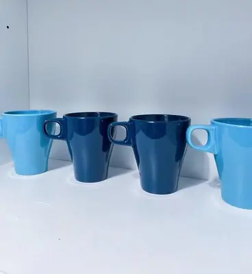 a group of blue cups sitting on a table at Beacon Executive Suites #Georgetown #RoofTopPool #Spacious #13a in George Town