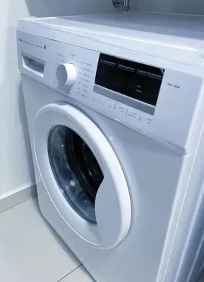 a white washing machine sitting in a room at Beacon Executive Suites #Georgetown #RoofTopPool #Spacious #13a in George Town