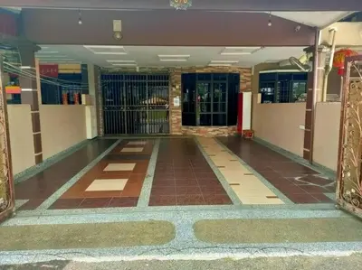 an empty hallway with a gate in a building at 678 homestay 4 room 5 minutes to tower in Teluk Intan