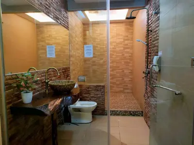a bathroom with a toilet and a sink and a shower at 678 homestay 4 room 5 minutes to tower in Teluk Intan