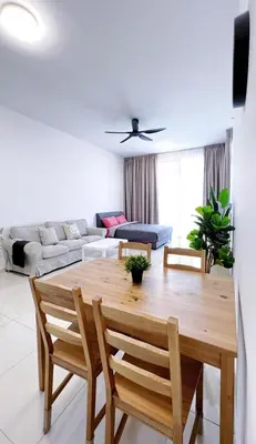 a living room with a wooden table and chairs at Beacon Executive Suites #Georgetown #RoofTopPool #23A in George Town
