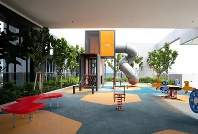 a playground with a slide in a building at Beacon Executive Suites #Georgetown #RoofTopPool #23A in George Town
