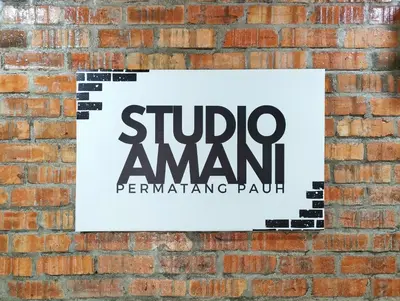 a sign on a brick wall with the subway amant performing park at Studio Amani 1 Permatang Pauh in Permatang Pauh
