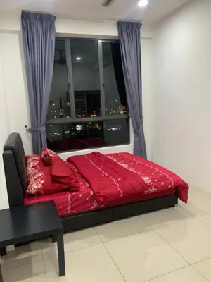 a bedroom with a red bed in front of a window at SM Homestay @ Meru Casa Kayangan in Ipoh