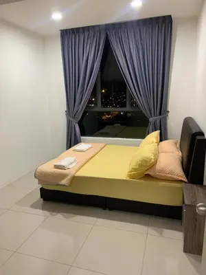 a bed in a room with a window with purple curtains at SM Homestay @ Meru Casa Kayangan in Ipoh