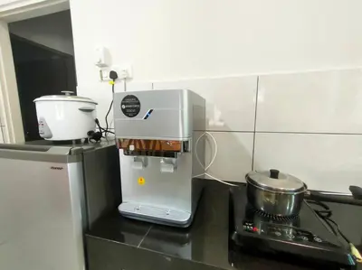 a mixer sitting on a counter in a kitchen at AVENUE HOMESTAY 5 Room 4 Toilet 4 MINUTES TO TOWER in Teluk Intan