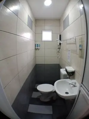 a small bathroom with a toilet and a sink at AVENUE HOMESTAY 5 Room 4 Toilet 4 MINUTES TO TOWER in Teluk Intan
