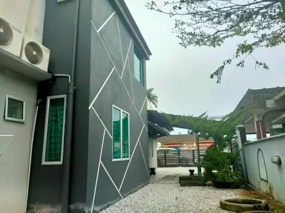 a building with white lines painted on the side of it at AVENUE HOMESTAY 5 Room 4 Toilet 4 MINUTES TO TOWER in Teluk Intan