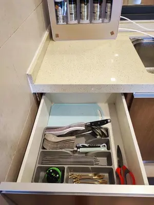 a drawer in a cabinet filled with utensils at Muji Homestay @ The Retreat, Cameron Highlands in Cameron Highlands