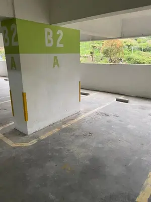 an empty parking garage with a b and a sign at zarraz homestay The Retreat Nova Kea Farm Brinchang in Brinchang