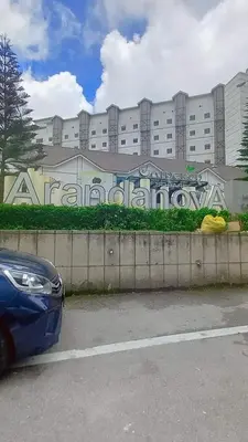 a blue car parked in front of a building with graffiti at zarraz homestay The Retreat Nova Kea Farm Brinchang in Brinchang