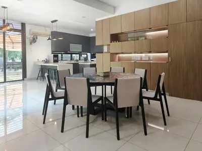 a dining room with a black table and chairs at Ocean 23 Batu Ferringhi Shamrock Beach with Swimming Pool 7 Bedroom 30pax in Batu Ferringhi
