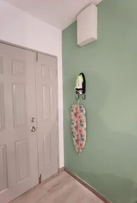 a room with a door and a sock hanging on the wall at Emerald Avenue Cozy 3R3B Apartment - 329 in Brinchang