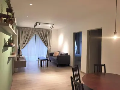 a living room with a table and a couch at Emerald Avenue Cozy 3R3B Apartment - 329 in Brinchang