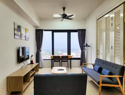 a living room with a blue couch and a large window at The MINDI, 2BR Cityview by WStay @ Tropicana 218 Macalister in George Town