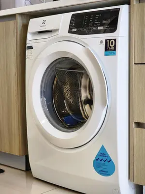 a white washing machine sitting in a kitchen at The MINDI, 2BR Cityview by WStay @ Tropicana 218 Macalister in George Town