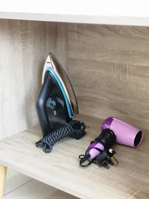 a hair dryer sitting on a shelf next to a sink at The MINDI, 2BR Cityview by WStay @ Tropicana 218 Macalister in George Town