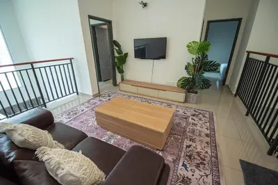 a living room with a couch and a coffee table at De Luma-Metropol in Bukit Mertajam