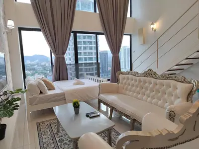 a living room with a couch and chairs and windows at Gurney Duplex / 2bedrooms / 8pax in George Town