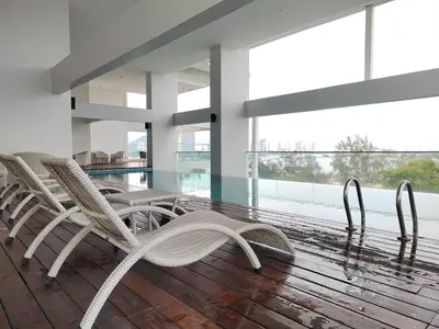 a group of chairs sitting on a wooden floor in a building at Gurney Duplex / 2bedrooms / 8pax in George Town