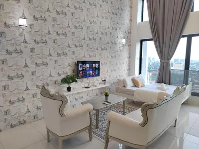 a living room with a bed and a couch at Gurney Duplex / 2bedrooms / 8pax in George Town