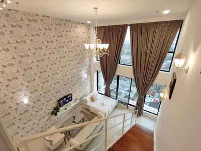 a living room with a brick wall at Gurney Duplex / 2bedrooms / 8pax in George Town