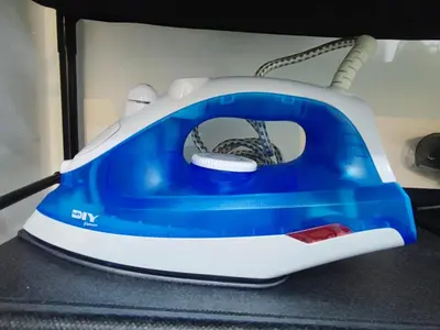 a blue and white toaster sitting on a table at Cosy Apartment Ipoh Town - WiFi Netflix FREE in Ipoh