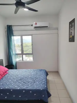 a bedroom with a bed and a ceiling fan at Cosy Apartment Ipoh Town - WiFi Netflix FREE in Ipoh