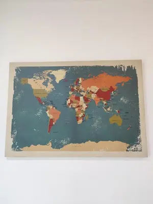 a map of the world hanging on a wall at Cosy Apartment Ipoh Town - WiFi Netflix FREE in Ipoh
