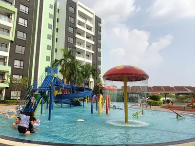 a water park with a slide and people in the water at Cozy homestay Manhattan Ipoh,12 pax \u6021\u4fdd\u6c11\u5bbf in Ipoh